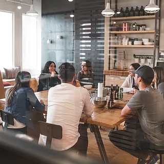 Remote working hub, people gathered around table